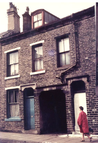 For much of his childhood, Charlie live at 34 Church Road, pictured on the left and beside the white van in the photograph above