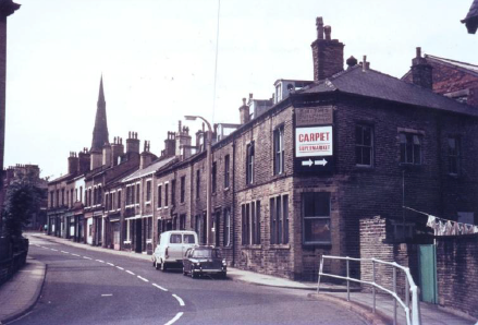 For much of his childhood, Charlie live at 34 Church Road, pictured on the left and beside the white van in the photograph above