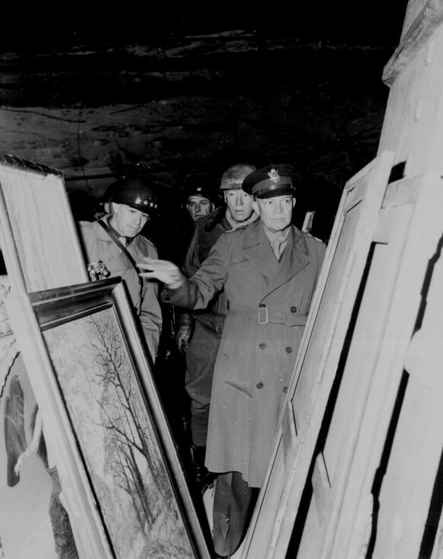 Eisenhower accompanied by Gen. Omar N. Bradley, and Lt. Gen. George S. Patton inspects stolen art treasures