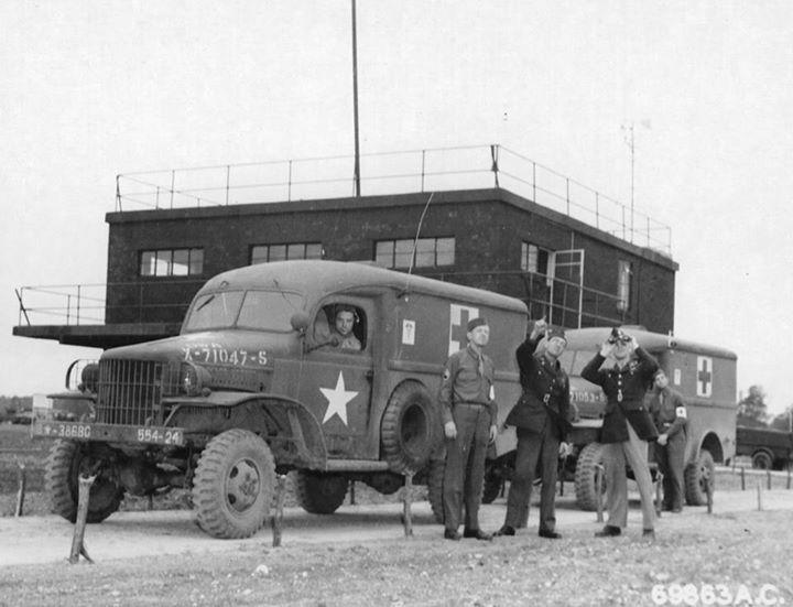 WC-27 ambulances of the 70th Service Group await the return of the 386th Bomb Group