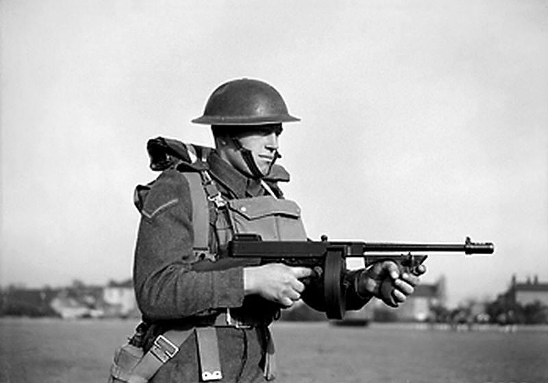East Surrey Regiment posed with a Thompson sub-machinegun