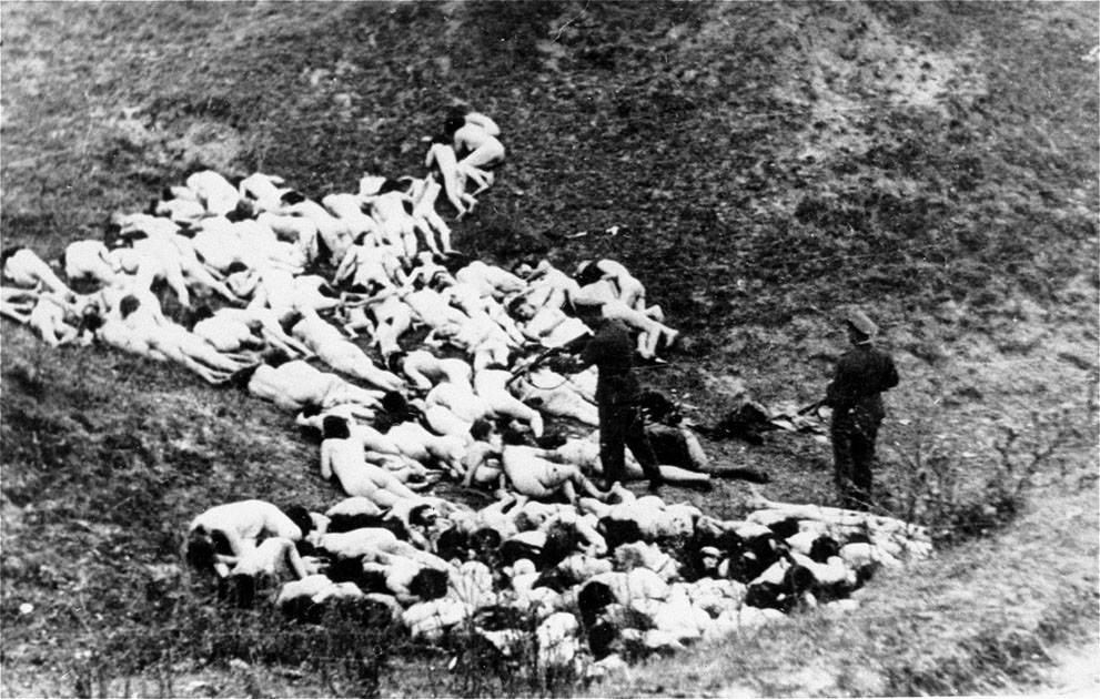 Two Germans ensuring that this group of massacred Ukrainian Jews were indeed all dead