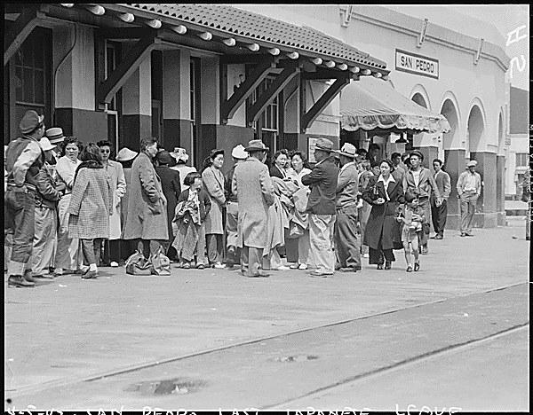 Evacuees of Japanese ancestry waiting for the train