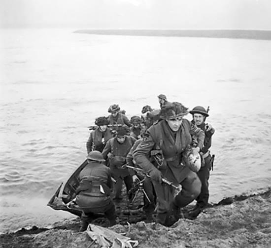 Men of the 15 Scottish Division leave their assault craft