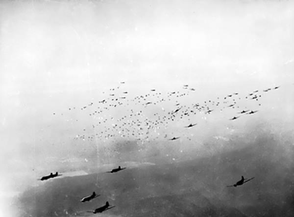 C-47 transport planes release hundreds of paratroops and their supplies over the Rees-Wesel