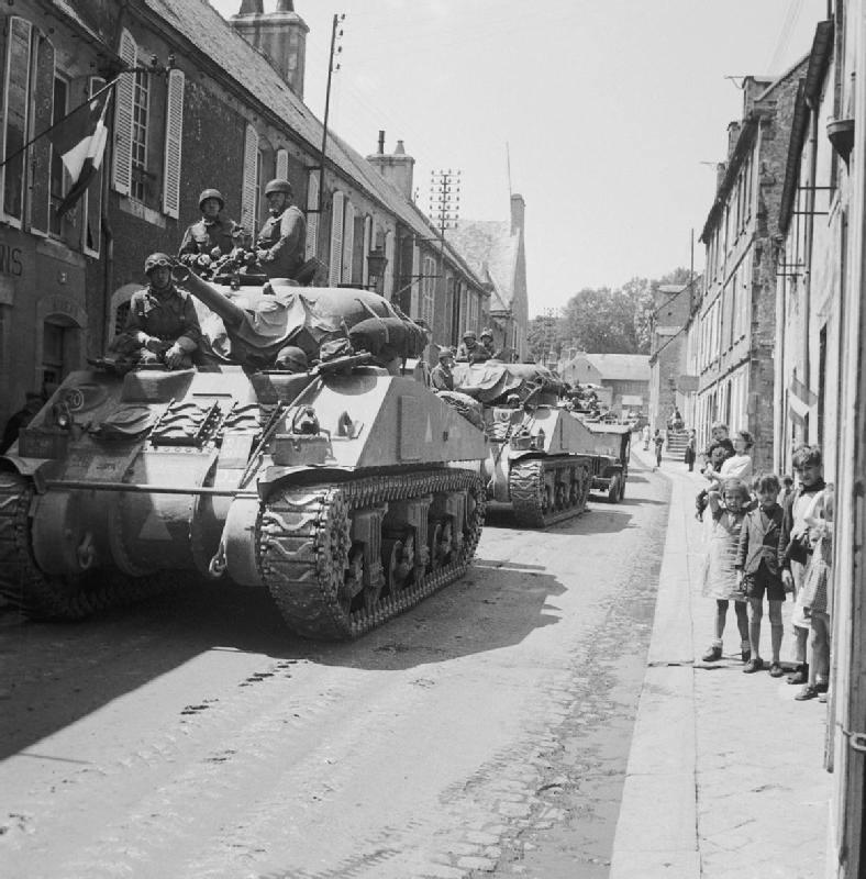 Sherman tanks of British 30th Corps passing through Bayeux