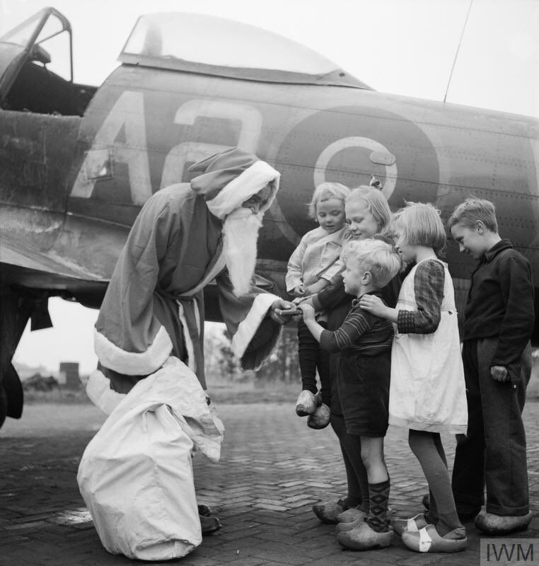 Santa Claus hands out presents to Dutch children 1944